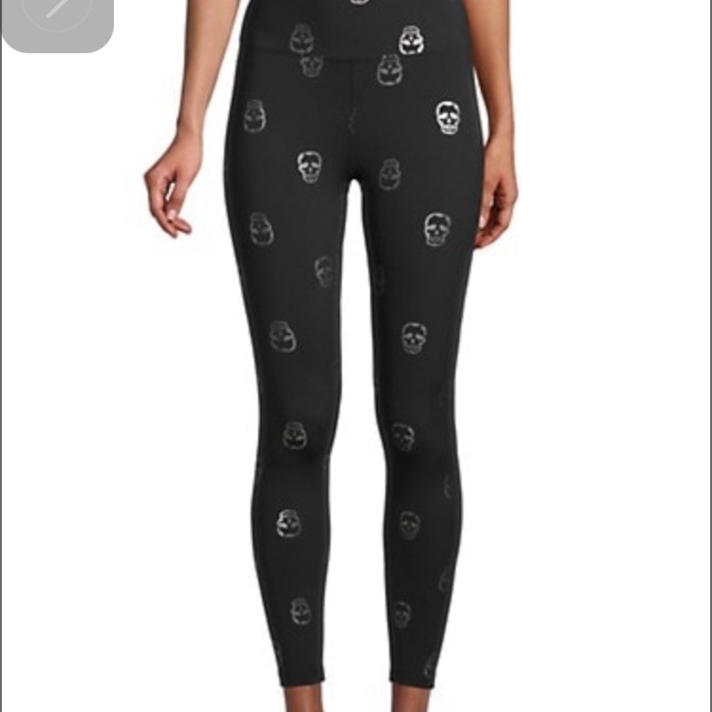 Saks off Fifth size small leggings in black with silver skulls